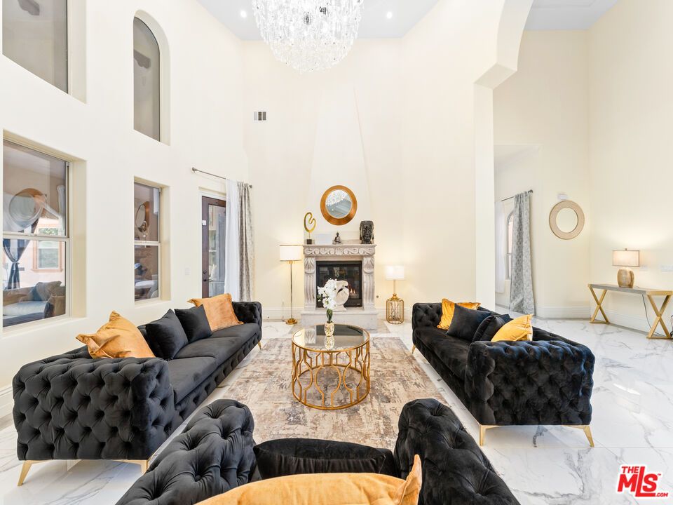 Chandelier, Fireplace, Interior, Living room, Marble, Recessed Lighting