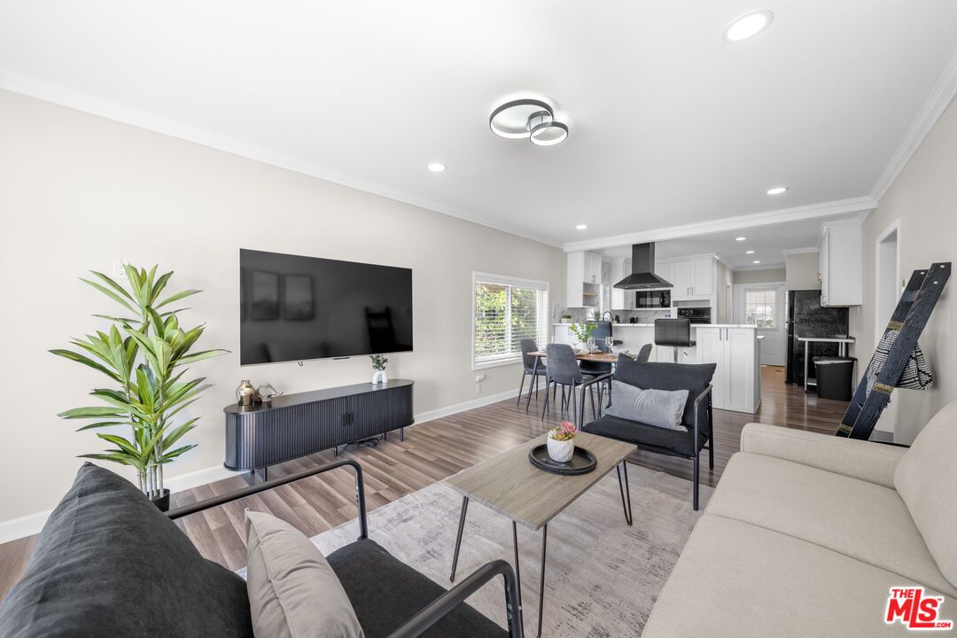 Dining room, Interior, Kitchen, Living room, Recessed Lighting, Stainless Steel Appliances, Wood Texture Flooring
