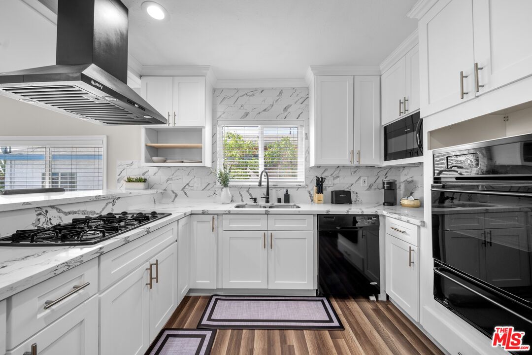 Interior, Kitchen, Marble Walls, Recessed Lighting, Stainless Steel Appliances, Wood Texture Flooring