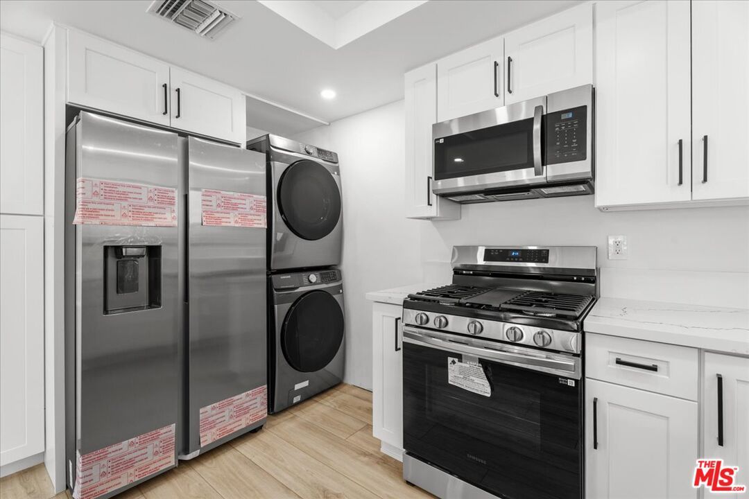 Interior, Kitchen, Recessed Lighting, Stainless Steel Appliances, Washer, Wood Texture Flooring