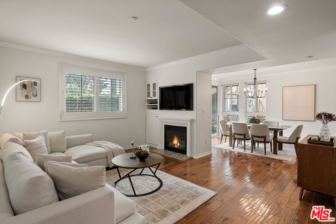Chandelier, Dining room, Fireplace, Interior, Living room, Recessed Lighting, Wood Texture Flooring
