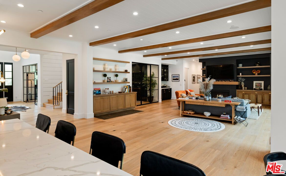 Dining room, Fireplace, Interior, Living room, Pendant Lights, Recessed Lighting, Wooden Beams, Wood Texture Flooring