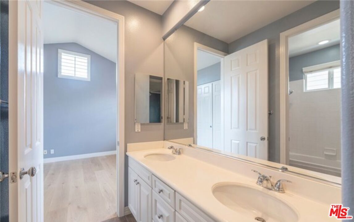 Bathroom, Dual Sink Vanities, Interior, Recessed Lighting, Wood Texture Flooring