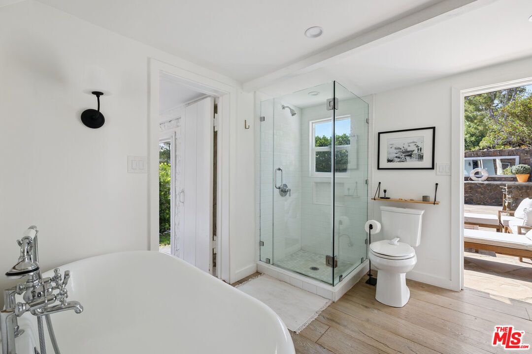 Bathroom, Free Standing Baths, Glass Shower, Interior, Recessed Lighting, Wood Texture Flooring