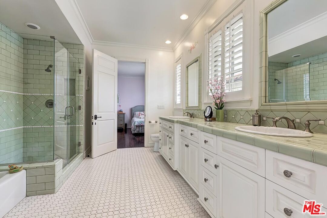 Bathroom, Dual Sink Vanities, Glass Shower, Interior, Recessed Lighting, Tile Countertops, Wood Texture Flooring