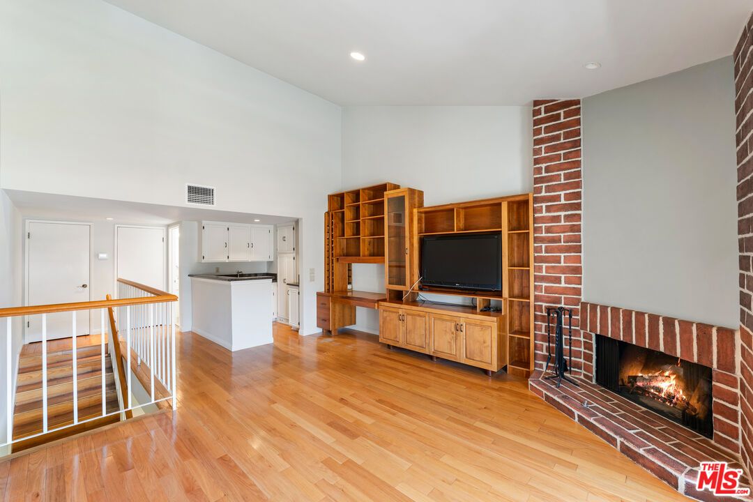 Fireplace, Interior, Kitchen, Recessed Lighting, Stone Walls, Wood Texture Flooring