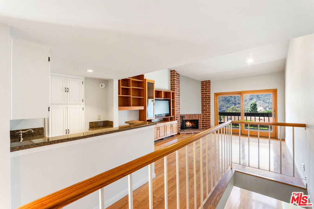 Fireplace, Interior, Recessed Lighting, Stone Walls, Wood Texture Flooring