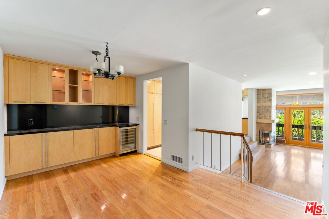 Empty room, Fireplace, Interior, Kitchen, Pendant Lights, Recessed Lighting, Wood Texture Flooring