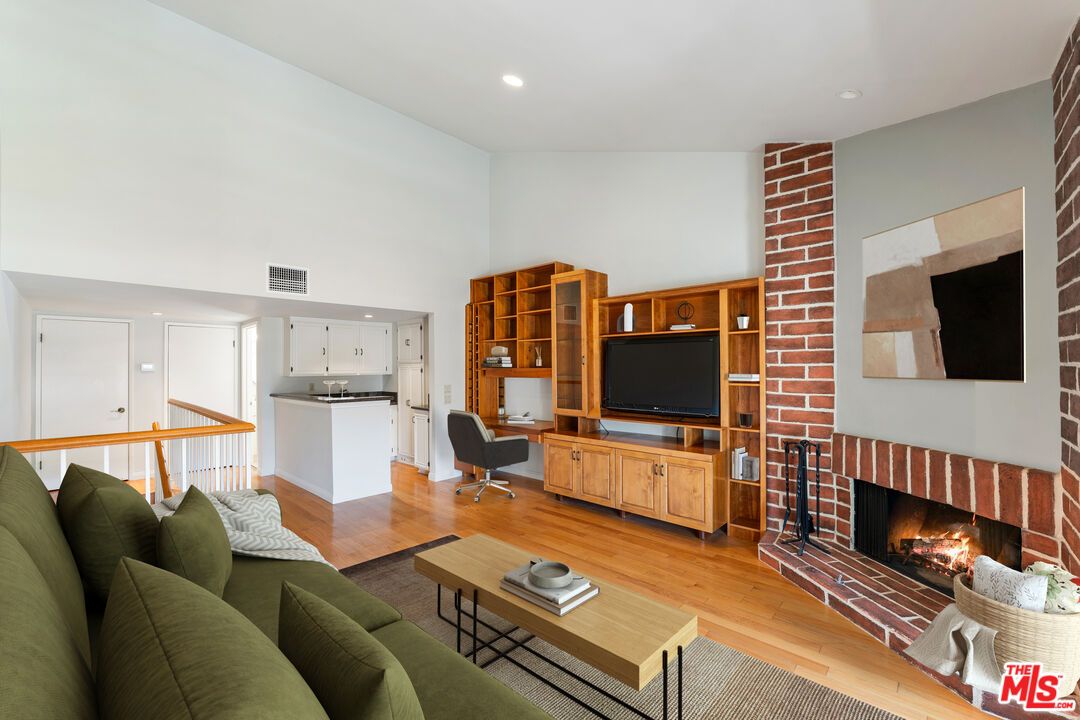 Fireplace, Interior, Living room, Recessed Lighting, Stone Walls, Wood Texture Flooring