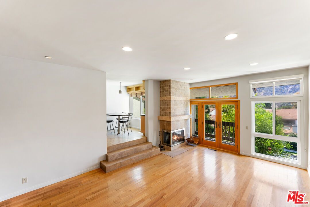 Dining room, Empty room, Fireplace, Interior, Pendant Lights, Recessed Lighting, Wood Texture Flooring