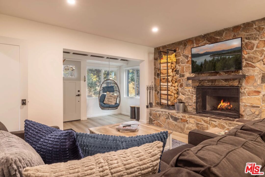 Fireplace, Interior, Living room, Recessed Lighting, Stone Walls, Wood Texture Flooring