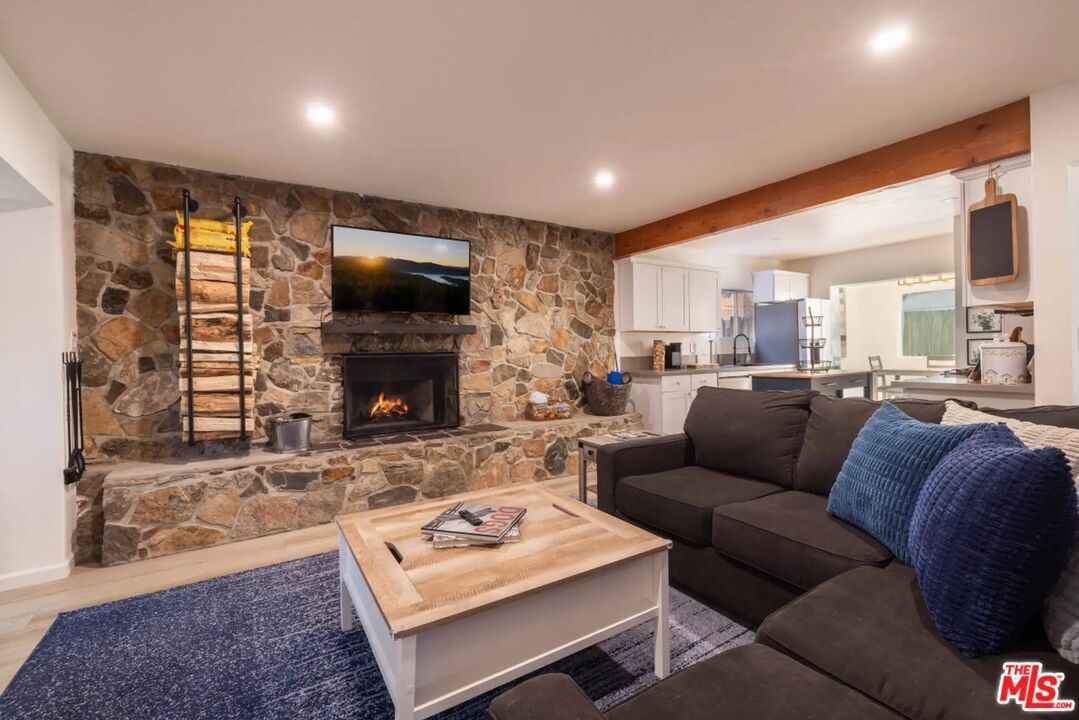 Fireplace, Interior, Living room, Recessed Lighting, Stone Walls, Wooden Beams