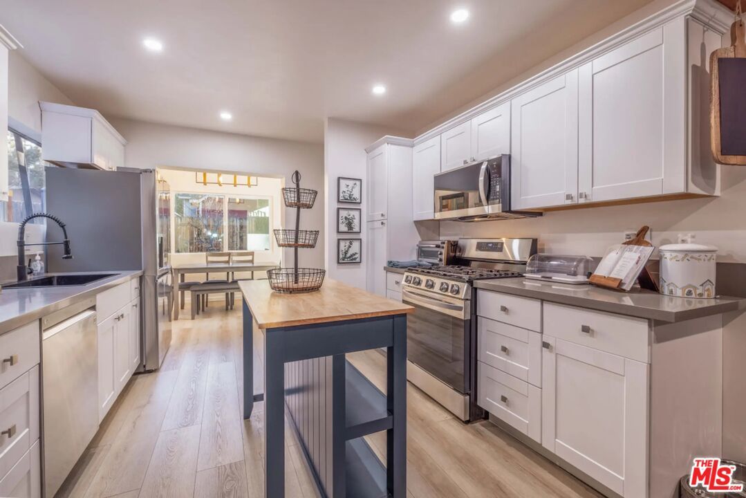 Dining room, Interior, Kitchen, Recessed Lighting, Stainless Steel Appliances, Wood Texture Flooring