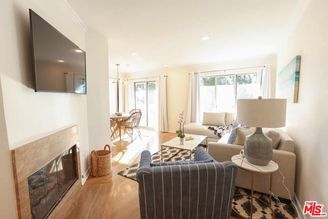 Dining room, Fireplace, Interior, Living room, Pendant Lights, Recessed Lighting, Wood Texture Flooring