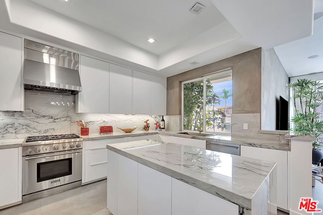 Interior, Kitchen, Marble Walls, Recessed Lighting, Stainless Steel Appliances