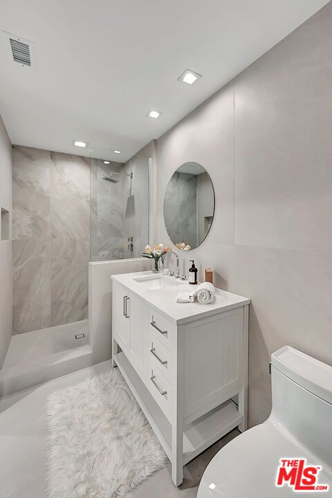 Bathroom, Dual Sink Vanities, Interior, Marble, Marble Walls, Recessed Lighting