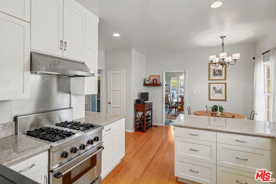 Chandelier, Dining room, Interior, Kitchen, Recessed Lighting, Stainless Steel Appliances, Wood Texture Flooring