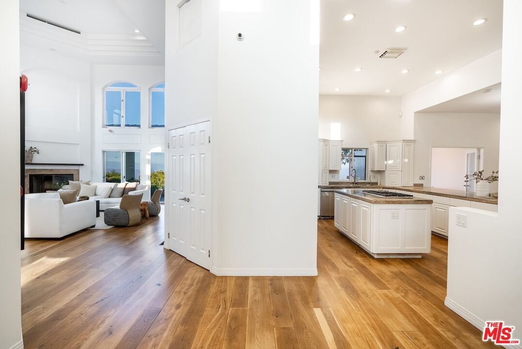 Fireplace, Interior, Kitchen, Living room, Recessed Lighting, Wood Texture Flooring