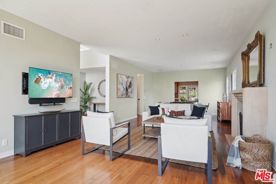 Dining room, Fireplace, Game Room, Interior, Living room, Recessed Lighting, Wood Texture Flooring