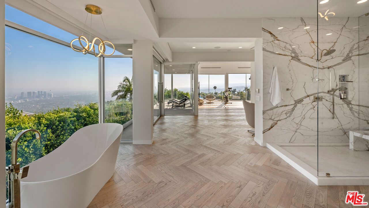 Bathroom, Free Standing Baths, Glass Shower, Interior, Marble Walls, Pendant Lights, Recessed Lighting, Wood Texture Flooring