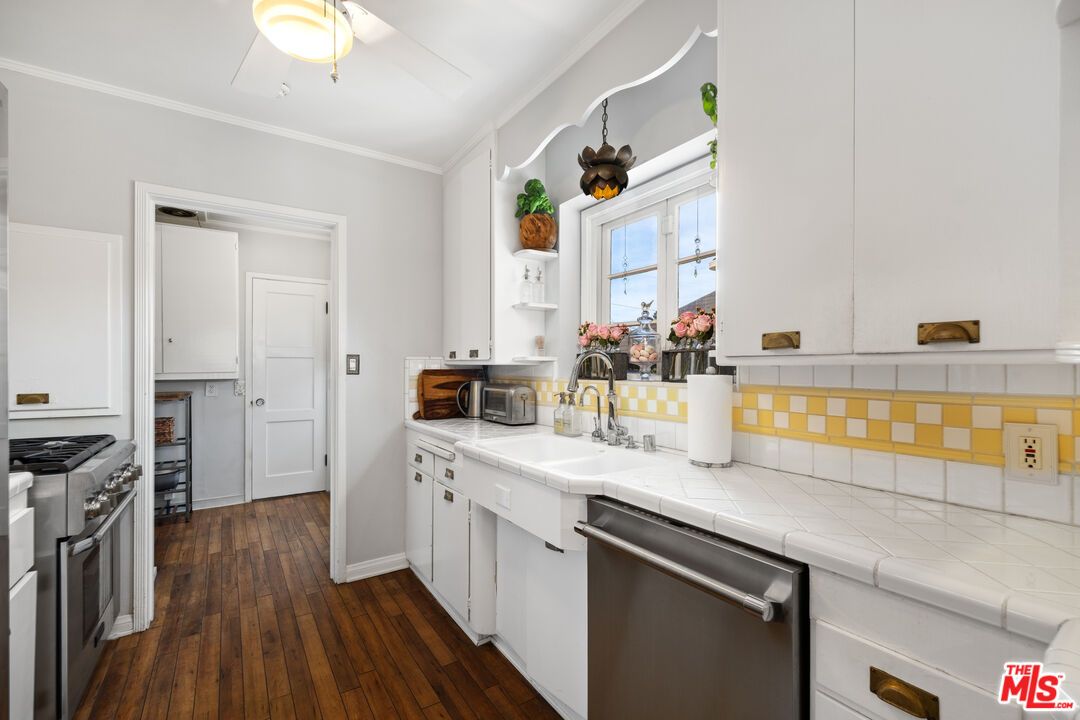 Interior, Kitchen, Stainless Steel Appliances, Tile Countertops, Wood Texture Flooring