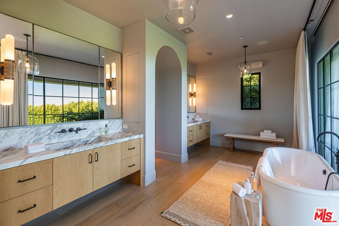 Bathroom, Dual Sink Vanities, Free Standing Baths, Interior, Pendant Lights, Recessed Lighting, Wood Texture Flooring