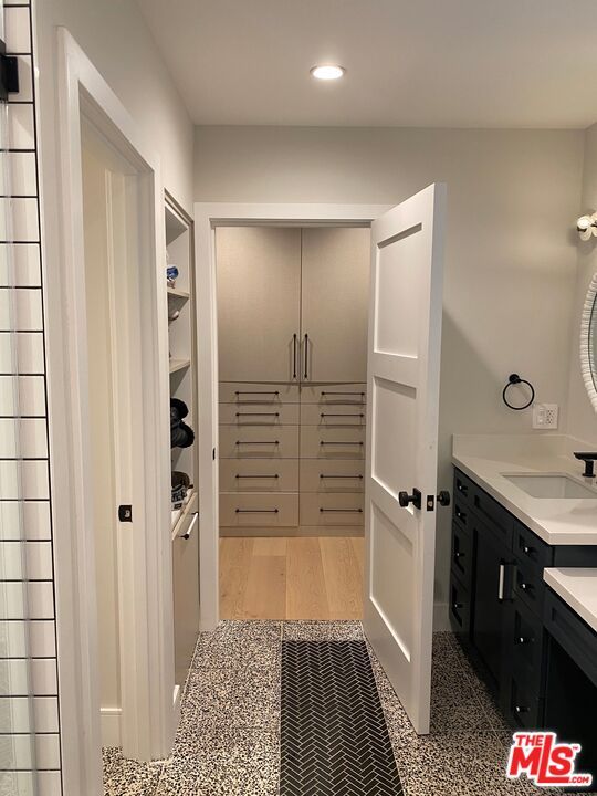 Bathroom, Dual Sink Vanities, Interior, Recessed Lighting, Walk-in Closets, Wood Texture Flooring