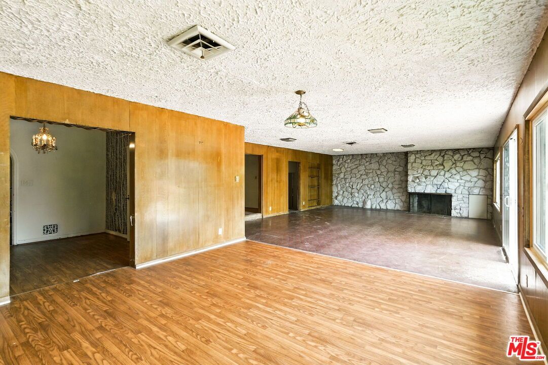 Empty room, Fireplace, Interior, Recessed Lighting, Stone Walls, Wood Texture Flooring, Wooden Walls