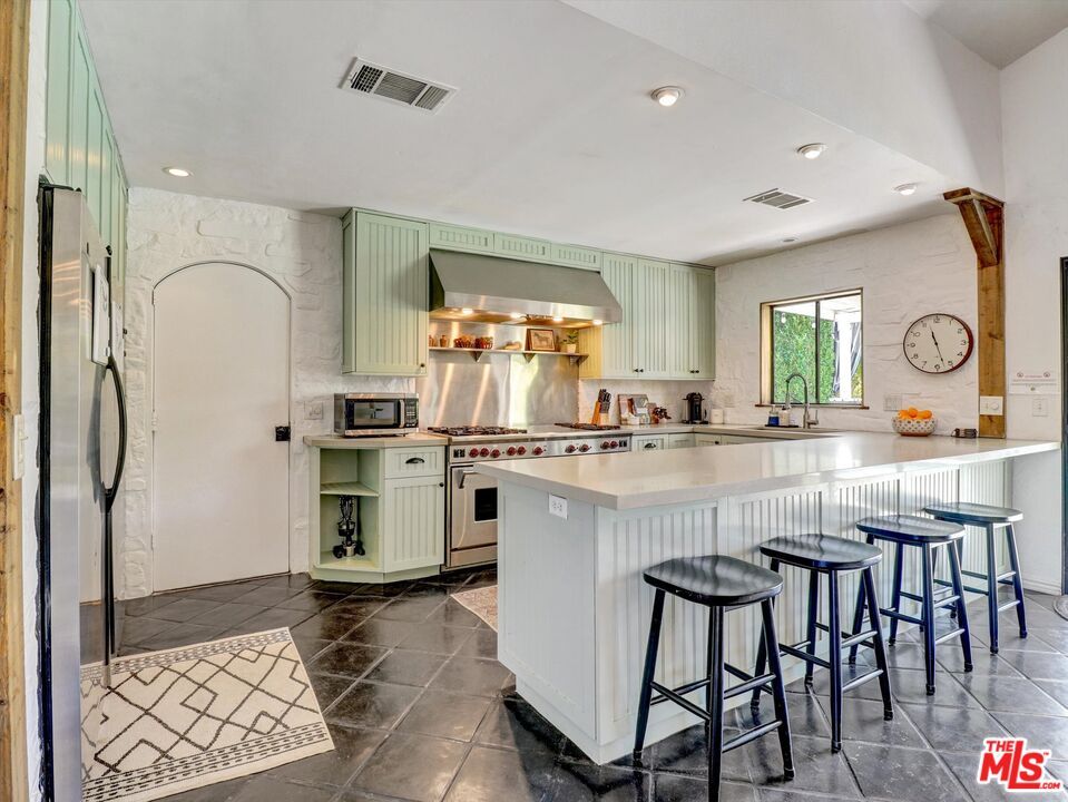 Interior, Kitchen, Marble Walls, Recessed Lighting, Stainless Steel Appliances