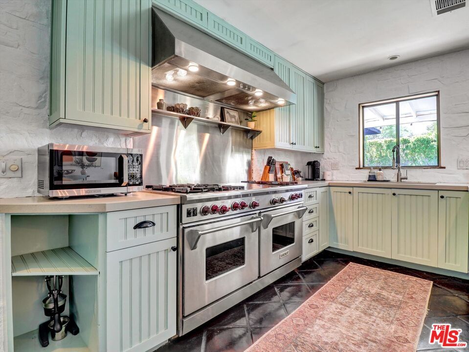 Interior, Kitchen, Marble Walls, Recessed Lighting, Stainless Steel Appliances