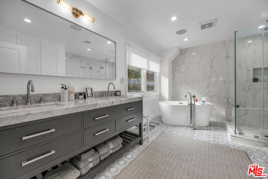 Bathroom, Dual Sink Vanities, Free Standing Baths, Glass Shower, Interior, Marble Walls, Recessed Lighting