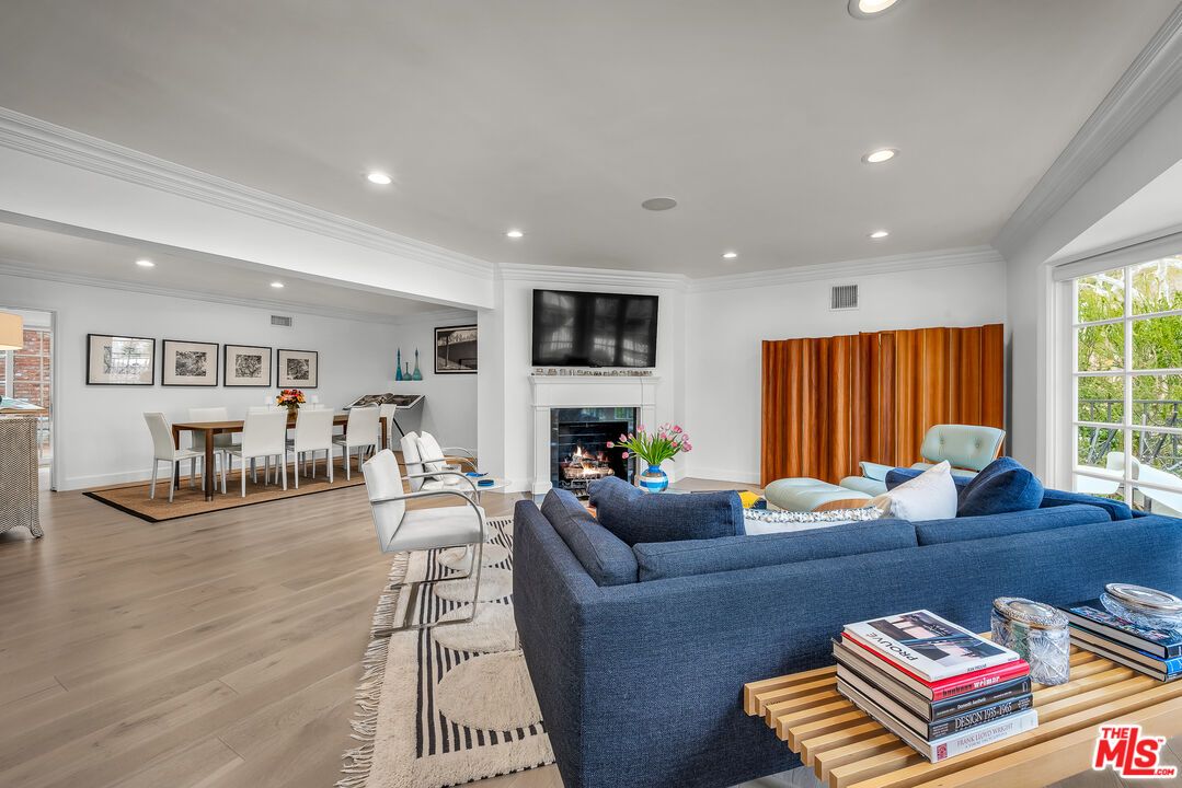 Dining room, Fireplace, Interior, Living room, Recessed Lighting, Wood Texture Flooring