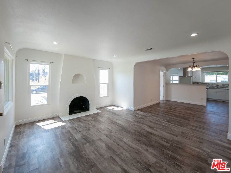 Empty room, Fireplace, Interior, Kitchen, Pendant Lights, Recessed Lighting, Wood Texture Flooring