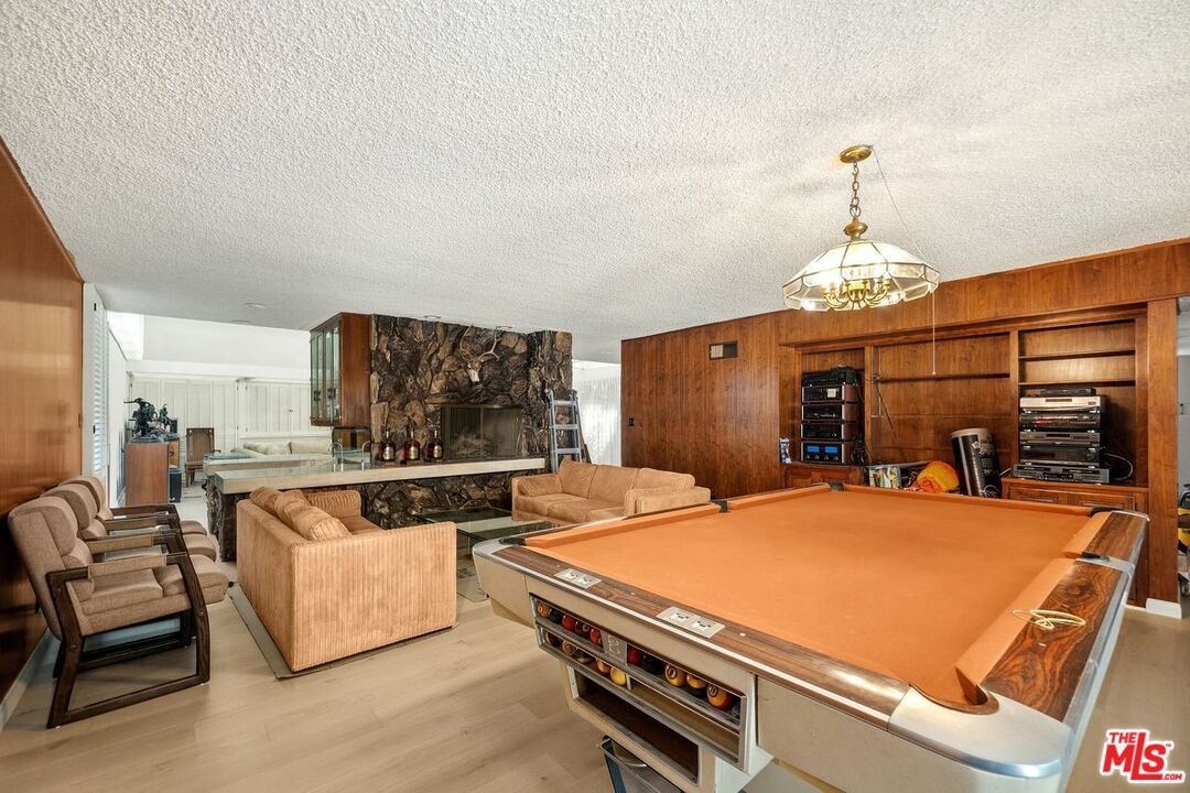Billiard Table, Fireplace, Game Room, Interior, Kitchen, Living room, Pendant Lights, Wood Texture Flooring, Wooden Walls