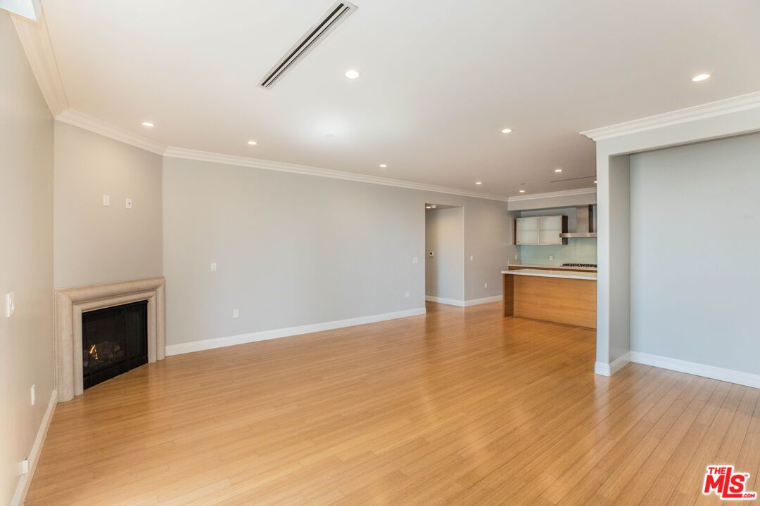 Empty room, Fireplace, Interior, Kitchen, Recessed Lighting, Wood Texture Flooring
