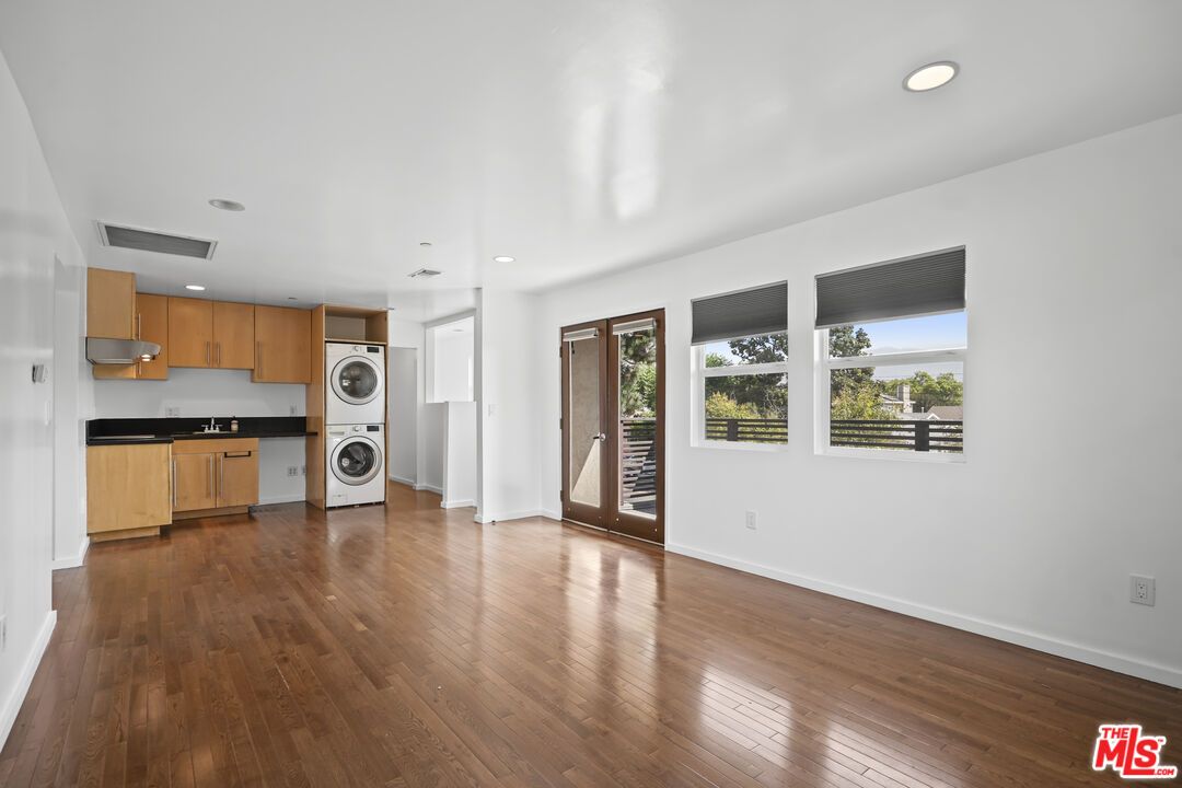 Empty room, Interior, Kitchen, Recessed Lighting, Washer, Wood Texture Flooring