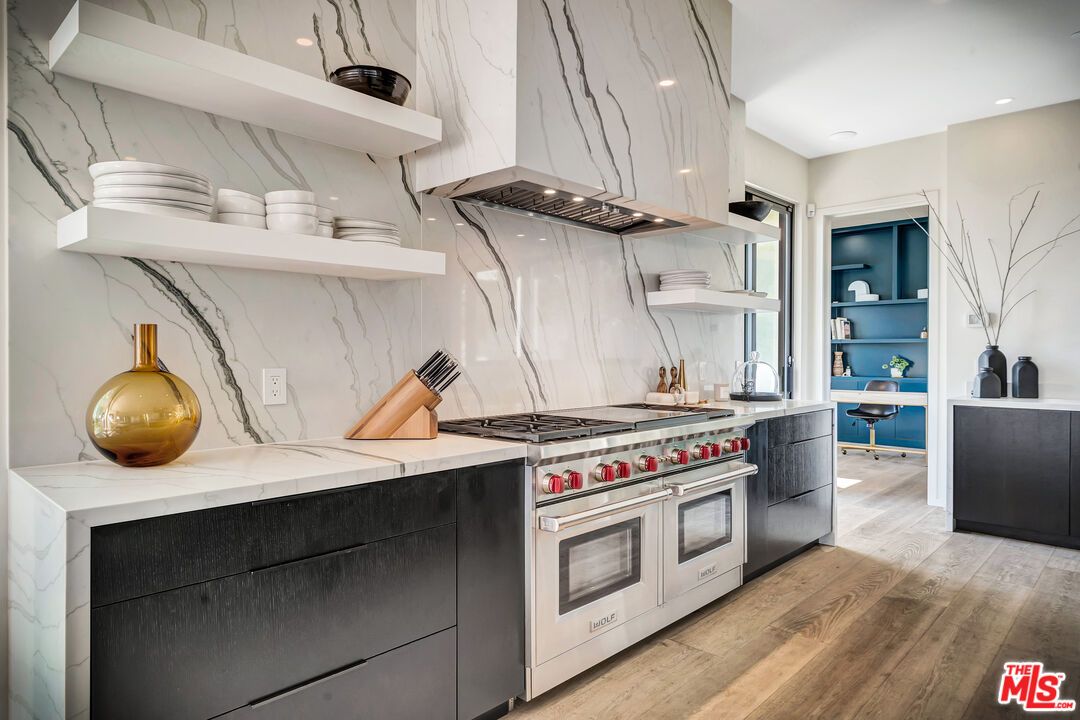 Interior, Kitchen, Marble Walls, Recessed Lighting, Stainless Steel Appliances, Wood Texture Flooring