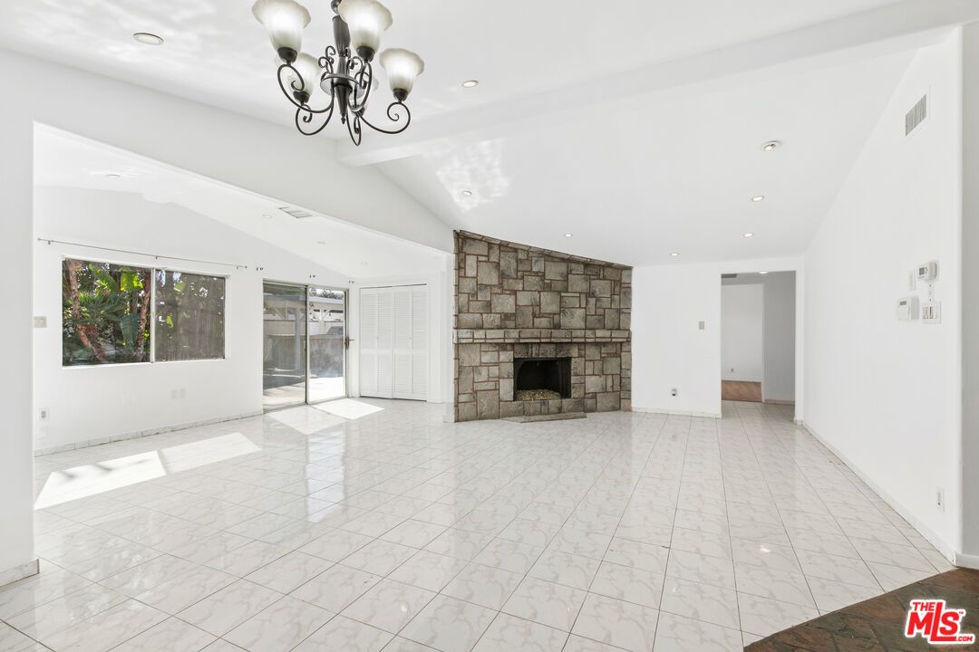 Chandelier, Empty room, Fireplace, Interior, Marble, Recessed Lighting, Stone Walls