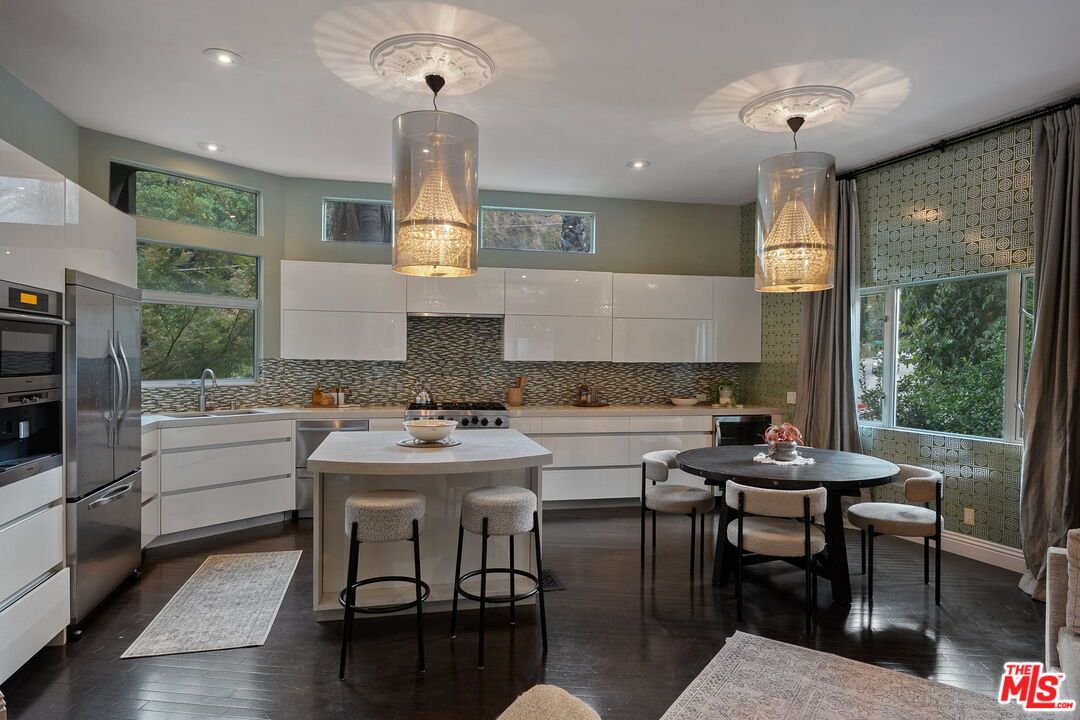 Dining room, Interior, Kitchen, Pendant Lights, Recessed Lighting, Stainless Steel Appliances, Wood Texture Flooring