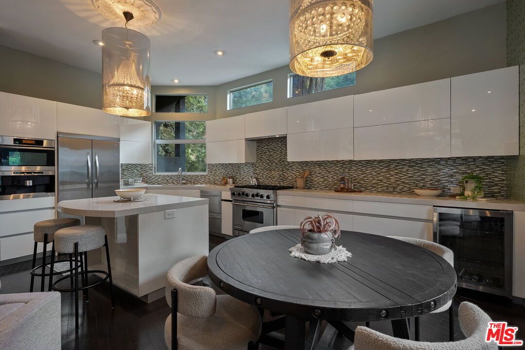 Dining room, Interior, Kitchen, Pendant Lights, Recessed Lighting, Stainless Steel Appliances, Wood Texture Flooring