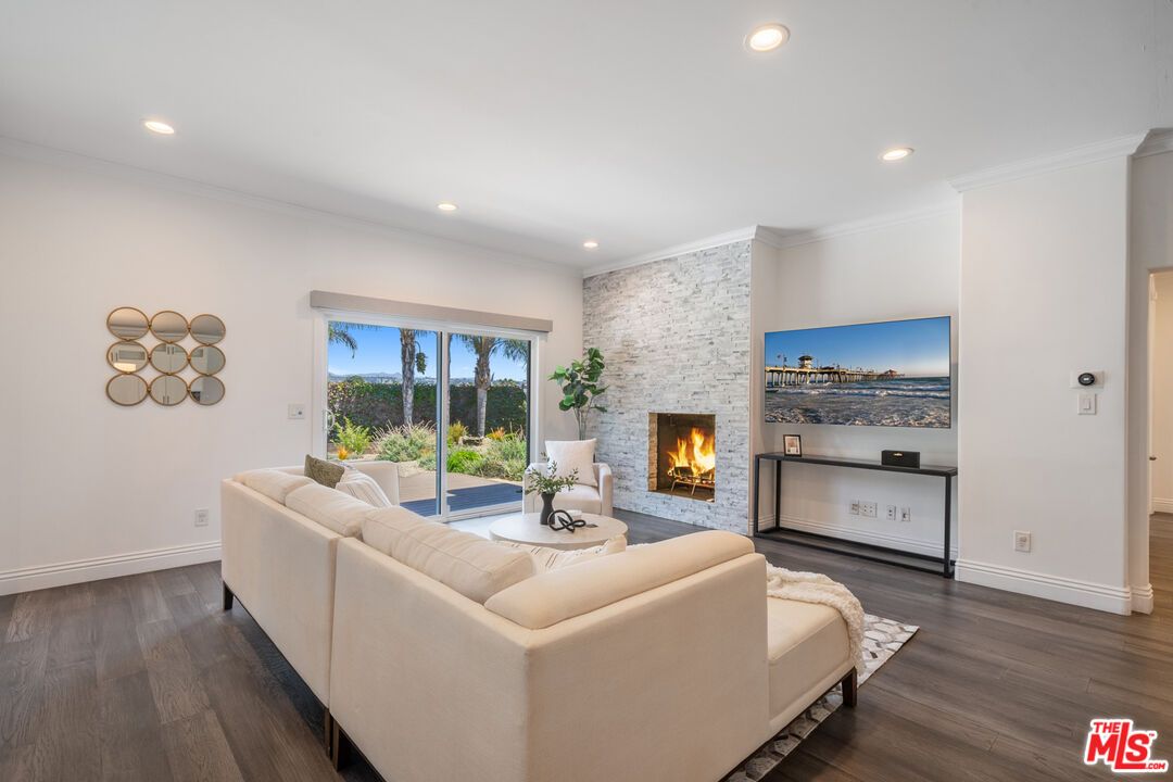 Fireplace, Interior, Living room, Recessed Lighting, Stone Walls, Wood Texture Flooring