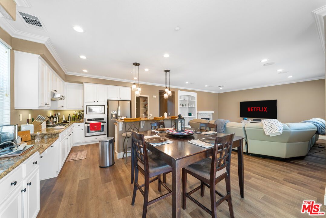 Dining room, Interior, Kitchen, Living room, Pendant Lights, Recessed Lighting, Stainless Steel Appliances, Wood Texture Flooring