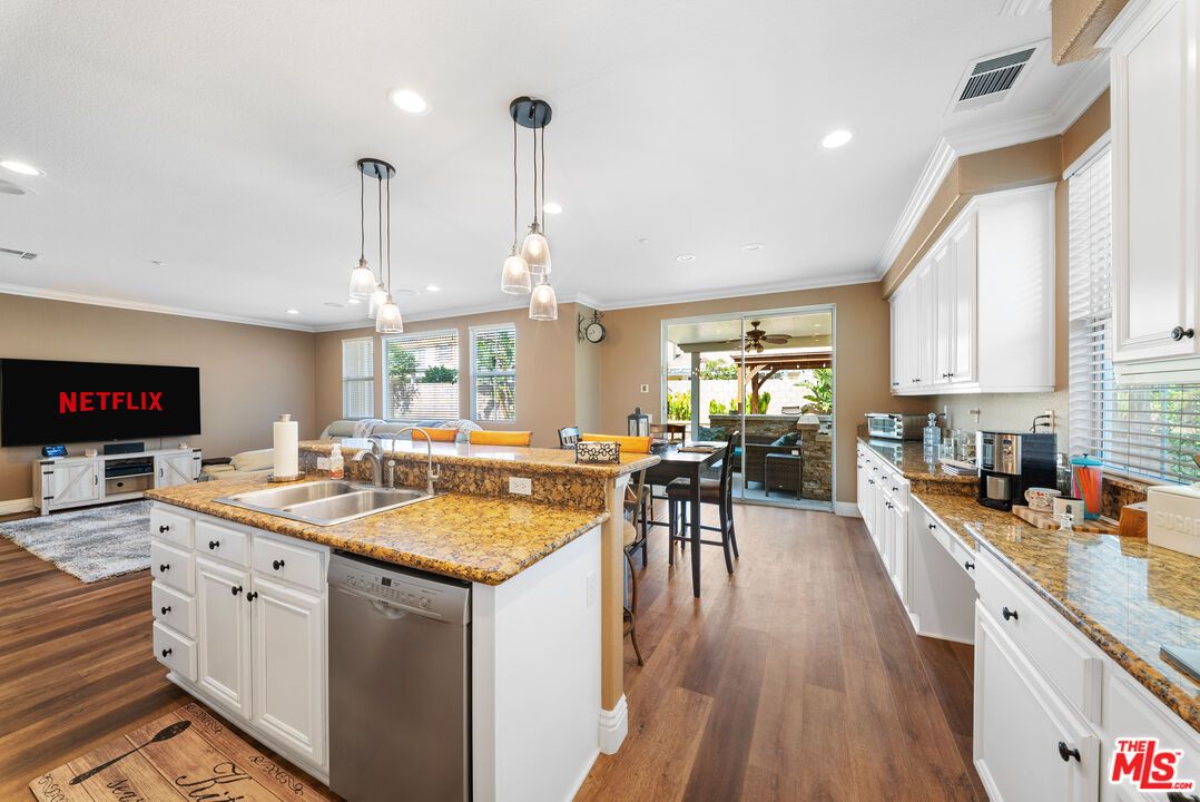 Dining room, Interior, Kitchen, Pendant Lights, Recessed Lighting, Stainless Steel Appliances, Wood Texture Flooring