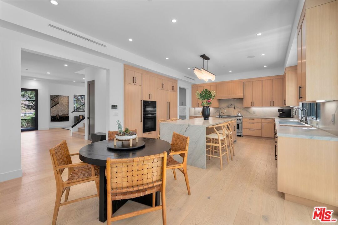 Dining room, Interior, Kitchen, Pendant Lights, Recessed Lighting, Stainless Steel Appliances, Wood Texture Flooring