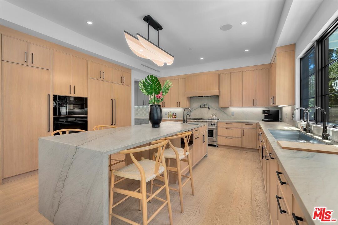 Interior, Kitchen, Marble Walls, Recessed Lighting, Stainless Steel Appliances, Wood Texture Flooring