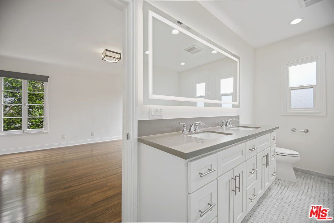 Bathroom, Dual Sink Vanities, Interior, Recessed Lighting, Wood Texture Flooring