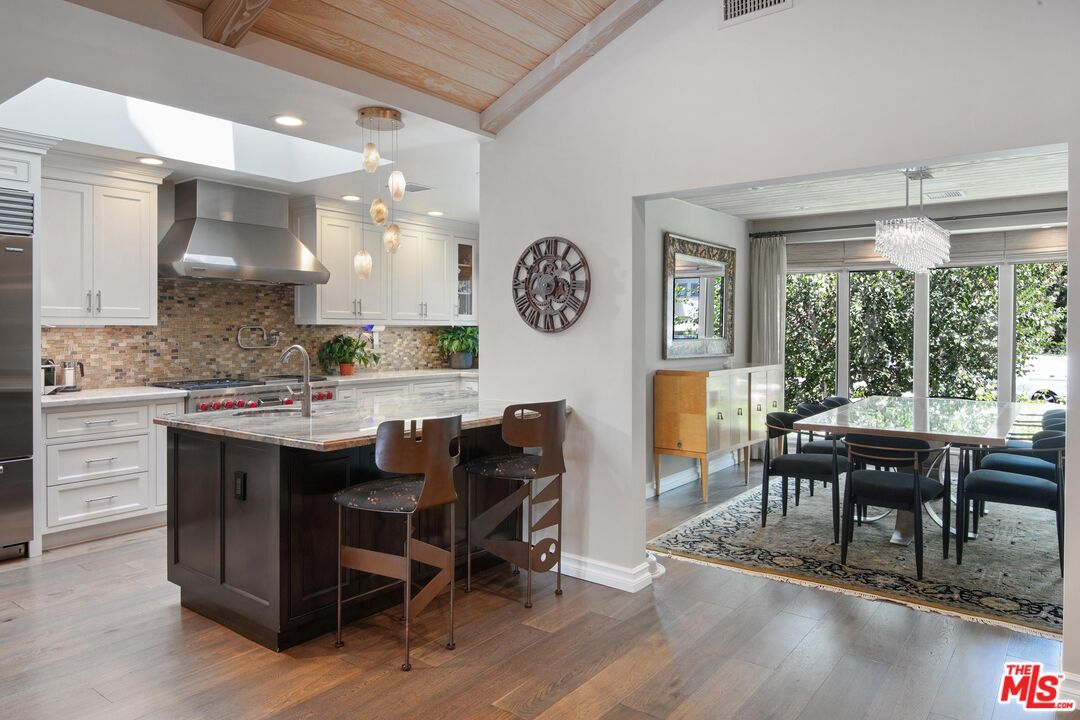 Chandelier, Dining room, Interior, Kitchen, Pendant Lights, Recessed Lighting, Stainless Steel Appliances, Wooden Ceilings, Wood Texture Flooring