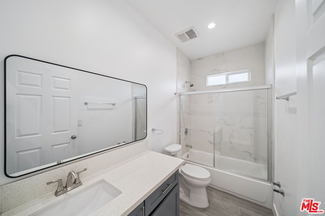 Bathroom, Glass Shower, Interior, Marble Walls, Recessed Lighting, Wood Texture Flooring