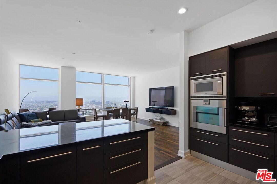 Dining room, Interior, Kitchen, Living room, Recessed Lighting, Stainless Steel Appliances, Wood Texture Flooring