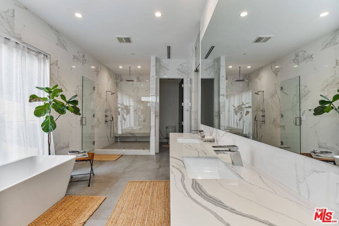 Bathroom, Dual Sink Vanities, Free Standing Baths, Glass Shower, Interior, Marble Walls, Recessed Lighting